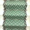 Green Herringbone stair runner with dark green woven border on white stairs