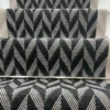 Black and white Herringbone Stair Runner with a grey woven border on white stairs