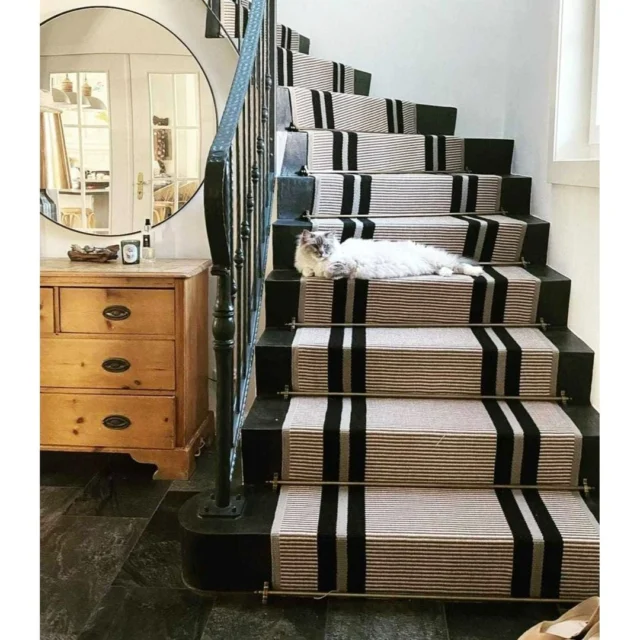 Our popular PNT16 stair runner strikes the perfect balance between subtle, delicate stripes and bold, standout patterns, creating a stunning focal point for any staircase. 

With its neutral color palette, it effortlessly complements any interior style, offering both versatility and timeless charm. 💫

Crafted in the UK from 100% wool for unmatched quality. 🐑

Product:PNT16 Bespoke width 1m00
Stairrods: Windsor, Pewter.